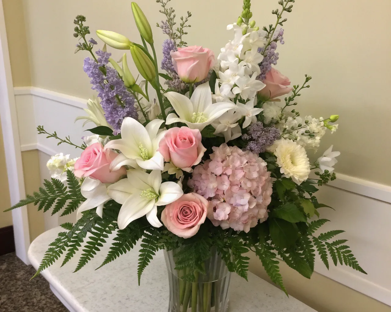 Sympathy floral arrangement in soft tones